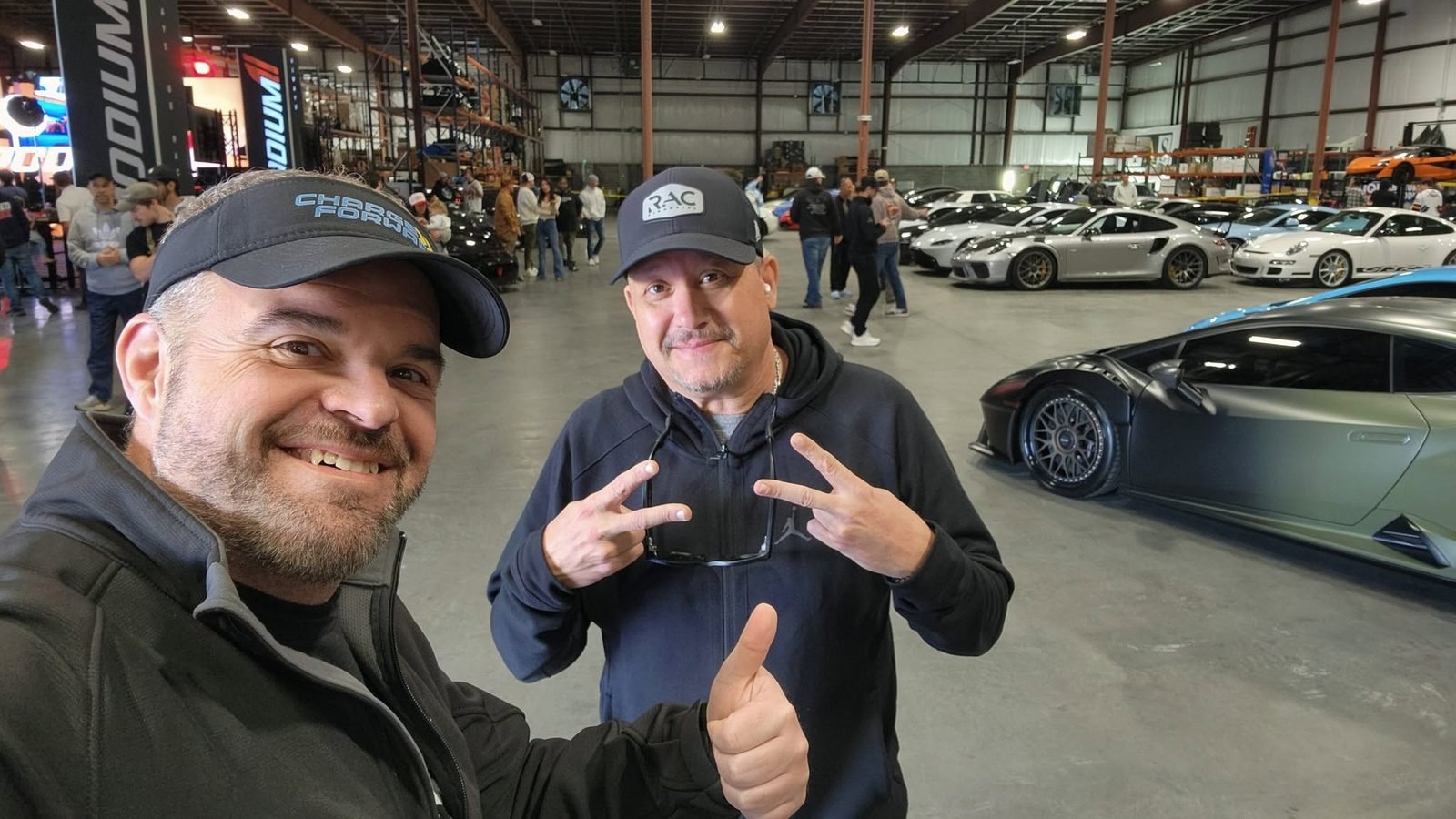 Jim Cripps with a partner at an exotic car event