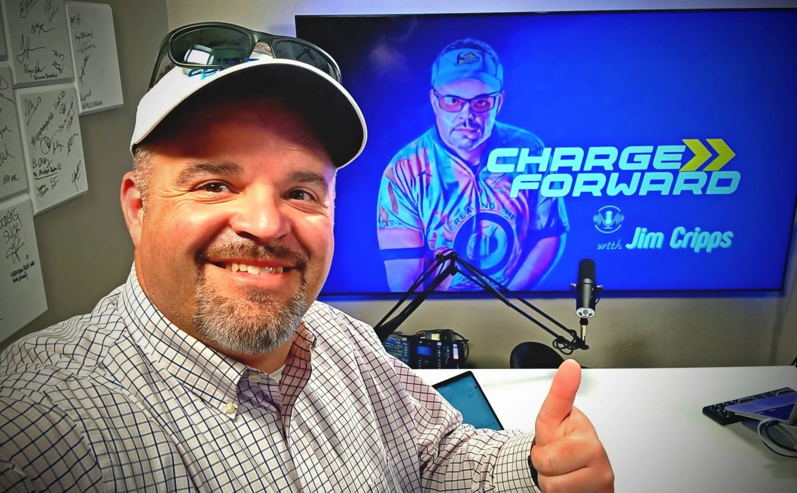 Jim Cripps smiling in the Charge Forward Podcast studio