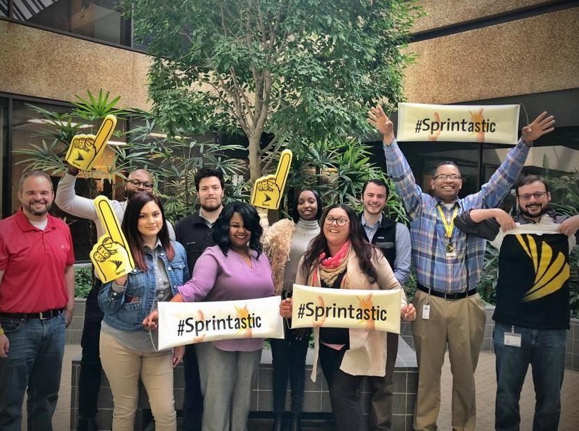 Jim Cripps with a team of employees celebrating